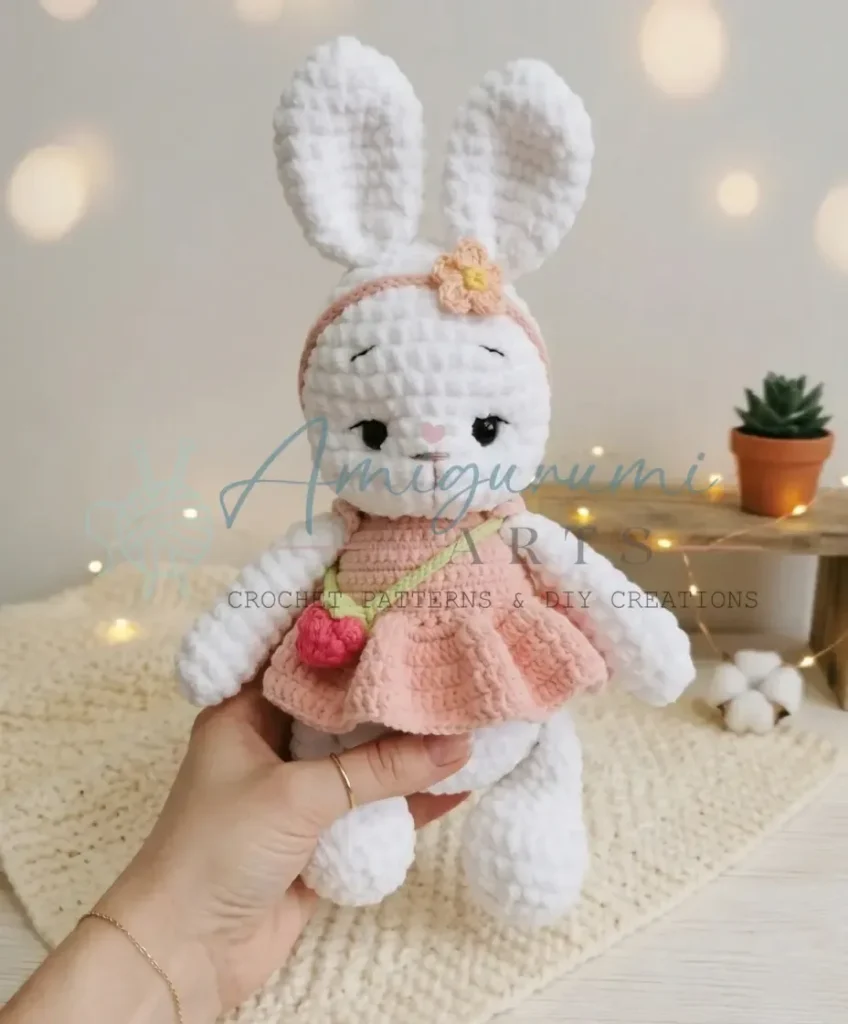 Crochet bunny amigurumi pattern with dress and raspberry
