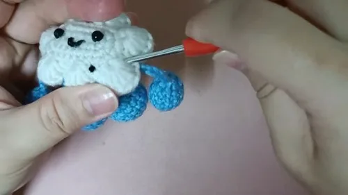 Crochet cloud doll keychain with a pink cone hat β photo 2