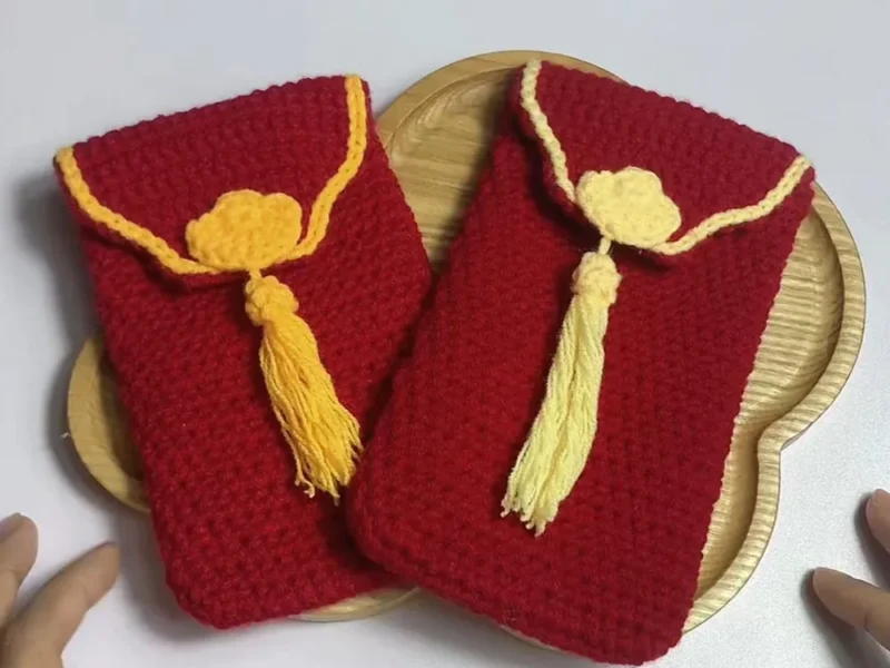 Crochet lucky money bag with a folded flap closure
