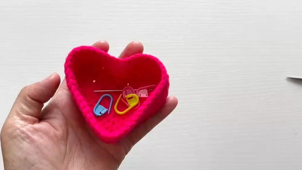 A heart-shaped crochet basket for small keepsakes