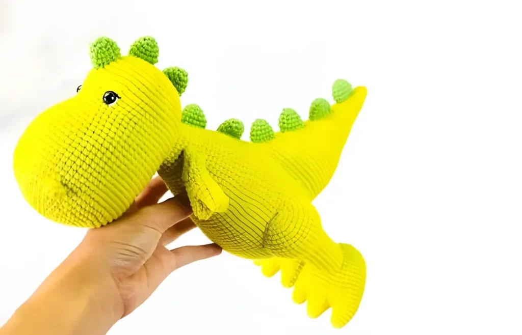 Amigurumi crochet dinosaur pattern for a friendly stuffed toy