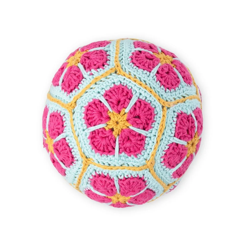 A crochet blossom ball built from twelve joined motifs